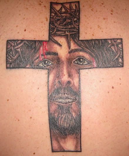 He got a cross tattooed below his right eye and it looks sick!